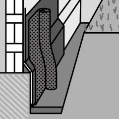 Detail einer Abdichtung an einer Hauswand, die das Erdreich schützt.